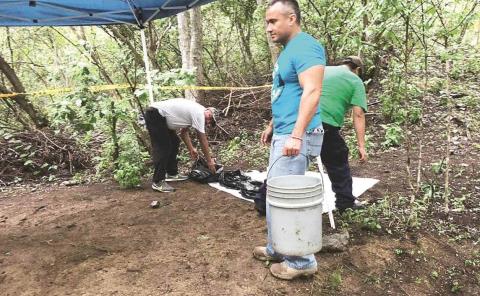 Buscan fosas clandestinas